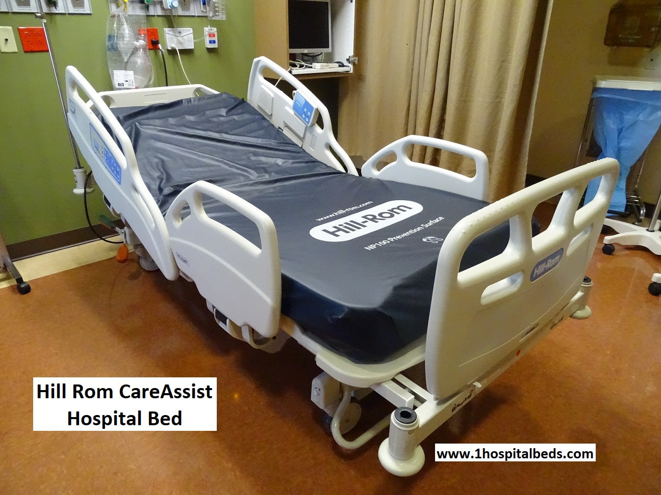 Refurbished Hill-Rom 11170 Care Assist hospital bed with foam mattress, featuring adjustable side rails and control panel.