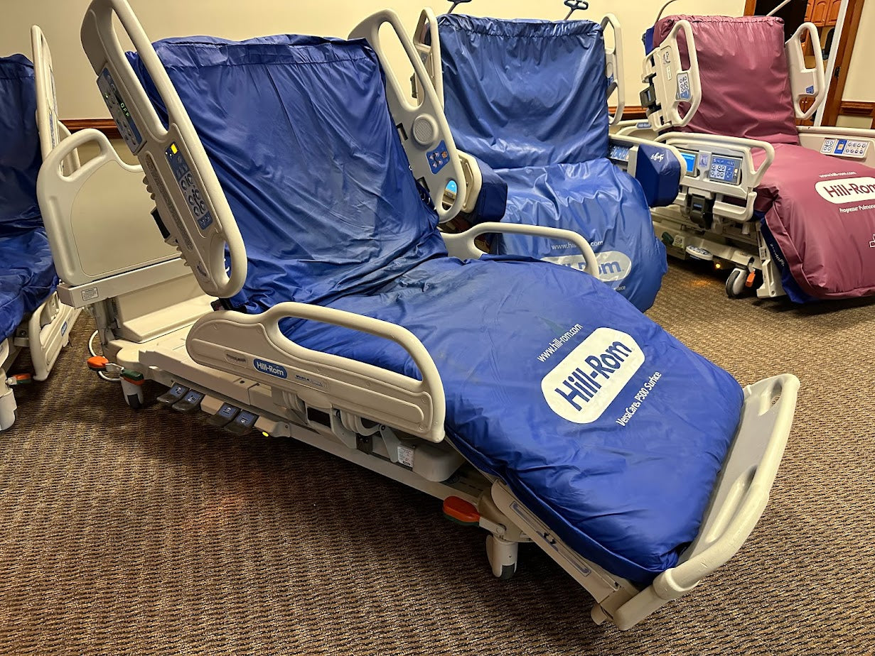 Hill Rom P3200 Versacare hospital bed with P500 air mattress system, featuring adjustable side rails and medical-grade design.