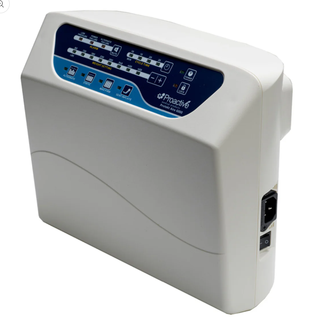 Mr. Hospital Bed Protekt Aire 6000 air mattress with built-in pump, shown in a close-up image highlighting the pump and mattress surface.