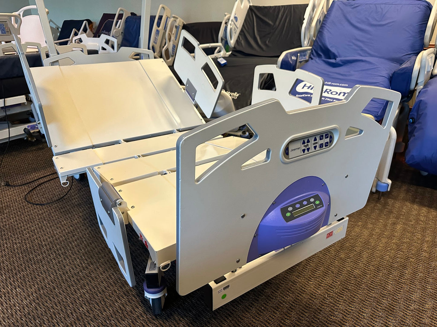 Stryker Joerns Bari10A bariatric hospital bed with extra-wide frame, adjustable side rails, and digital controls for patient comfort.