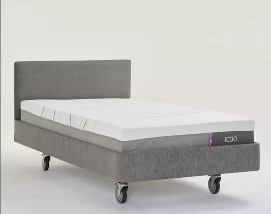 ICare IC100™ Static Partner Bed for long-term care, showing a sturdy hospital-style bed with side rails and adjustable head section.